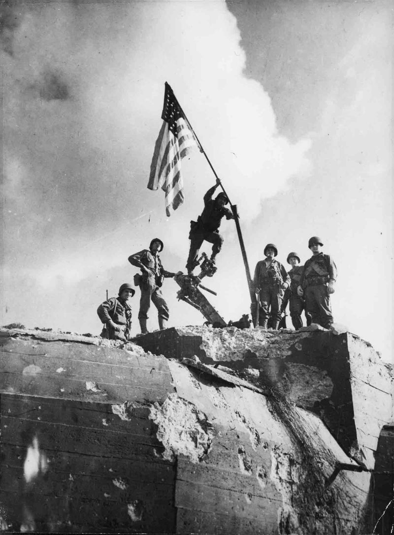 Re-print World War II. American flag flies over St. Malo