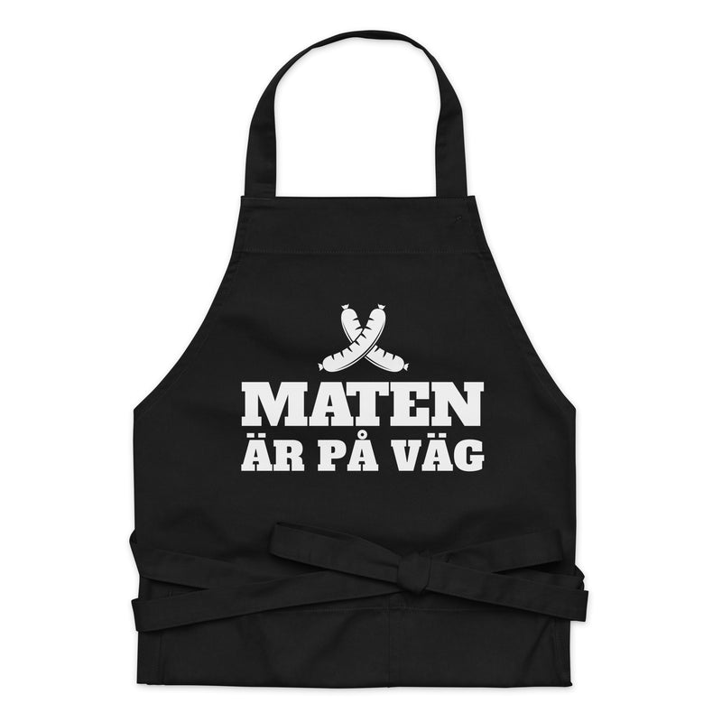 Förkläde med texten "Maten är på väg"