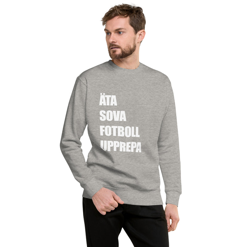 Sweatshirt med texten "ÄTA SOVA FOTBOLL UPPREPA"