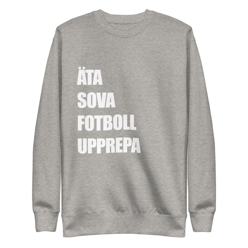 Sweatshirt med texten "ÄTA SOVA FOTBOLL UPPREPA"
